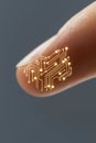 Microchip embedded in fingertip with metallic circuits merging into skin Royalty Free Stock Photo