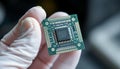 Microchip held by hand in a glove Royalty Free Stock Photo