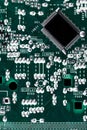Microchip integrated on green motherboard computer science Royalty Free Stock Photo