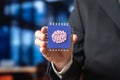 A microchip with neural network technology in the hands of a businessman Royalty Free Stock Photo