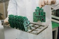 Microchip production factory. Technological process. Assembling the board. Chip. Professional. Technician. Computer Royalty Free Stock Photo