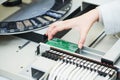 Microchip semiconductor manufacturing. operator with machine robot installing chip on board. Royalty Free Stock Photo