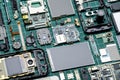 Microchips, semiconductor components and precious metals on the Board of disassembled old mobile phones