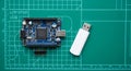 Microcontroller Board and Usb Flash Drive on Green Technical Work Surface Royalty Free Stock Photo