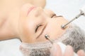 Microcurrent facial dermatology procedure. Model. Aesthetic radiofrequency treatment. Micro current cosmetology massage Royalty Free Stock Photo