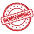 MICROECONOMICS text on red grungy round rubber stamp