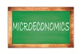 MICROECONOMICS text written on green school board