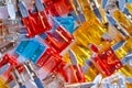 Microelectronics Concepts. Closeup Image of Batch of Colorful Fusable External Connectors Placed Bulk On White