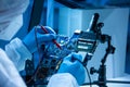 Microelectronics engineer works in a modern scientific laboratory on computing systems and microprocessors. Electronic