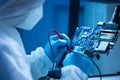 Microelectronics engineer works in a modern scientific laboratory on computing systems and microprocessors. Electronic
