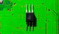 Microelectronics - Transistor on a Green PCB Royalty Free Stock Photo