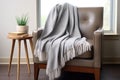 microfiber blanket draped over a modern chair