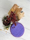 Microfiber sponge for cleaning dishes with kitchen items on the table. Accessories for house cleaning and cleanliness.