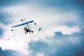 Microlight flying among the cranes Royalty Free Stock Photo