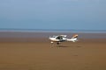 Microlight plane taking off from beach, Knott End Royalty Free Stock Photo