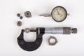 Micrometer, caliper and gear wheels for measurements. Workshop accessories Royalty Free Stock Photo