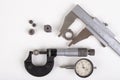 Micrometer, caliper and gear wheels for measurements. Workshop accessories