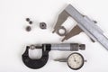 Micrometer, caliper and gear wheels for measurements. Workshop accessories Royalty Free Stock Photo