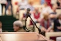 Microphone on abstract blurred of speech in seminar room or speaking conference hall light, Event Background