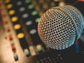 Microphone on amplifier equipment and out of focus background.: Royalty Free Stock Photo