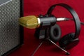 Microphone with Amplifier and Headphones on a Red Cloth Background Royalty Free Stock Photo