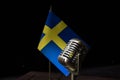 Microphone on a background of a blurry flag Sweden close-up