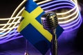 Microphone on a background of a blurry flag Sweden close-up