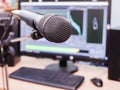Microphone on the background of the computer monitor. Home recording Studio. Close-up. The focus in the foreground