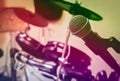Microphone on blur drum background by vintage tone and vignettin Royalty Free Stock Photo