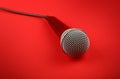 Microphone with cable high angle close up over red Royalty Free Stock Photo