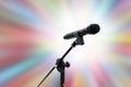 Microphone close up shot on blurred soft gradient zoom colorful effect light pink blue shade bokeh abstract background, party Sing