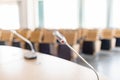 Microphone close-up. Big empty modern conference hall in luxury hotel. Audience for Speakers at Business convention and Royalty Free Stock Photo