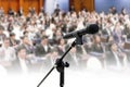 Microphone on Blurred many people seminar Meeting room business big hall Conference background Royalty Free Stock Photo