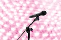 Microphone close up shot on blur heart bokeh Pink background beautiful romantic or glitter lights heart soft pastel shade Royalty Free Stock Photo