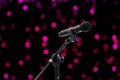 Microphone close up shot on blurred bokeh Purple Pink background beautiful romantic or glitter lights circle soft on dark Royalty Free Stock Photo