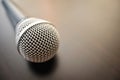 Microphone close up on a wooden surface