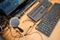 Microphone and computer keyboards on table at television studio Royalty Free Stock Photo