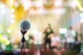 Microphone in concert hall or conference room soft and blur style for background.Microphone over the Abstract blurred photo of co Royalty Free Stock Photo