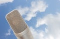 Microphone condenser on sky cloud a background