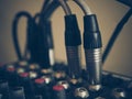 Microphone connectors pluged in a audio music mixing console. Vi Royalty Free Stock Photo