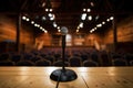 microphone on dark wooden lectern against out of focus audience