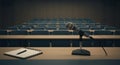 Microphone on Desk in Empty Classroom for Speech or Presentation Royalty Free Stock Photo