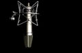 Microphone detail in music and sound recording studio, black background, closeup Royalty Free Stock Photo