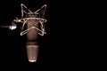 Microphone detail in music and sound recording studio, black background, closeup Royalty Free Stock Photo