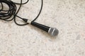 Microphone dynamic on floor marble polished stone background Royalty Free Stock Photo