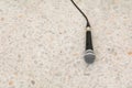 Microphone dynamic on floor marble polished stone background Royalty Free Stock Photo