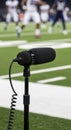 Microphone on football field sideline broadcasting Royalty Free Stock Photo