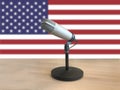 Microphone in front of an amercan flag Royalty Free Stock Photo