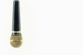 Microphone Gold and black on isolated white. Royalty Free Stock Photo