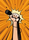 Microphone in hand drawn in pop art retro comic style. Cartoon vector illustration Royalty Free Stock Photo